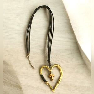 Beautiful Gold Heart Necklace with Copper Colored Cross Suspended in the Center
